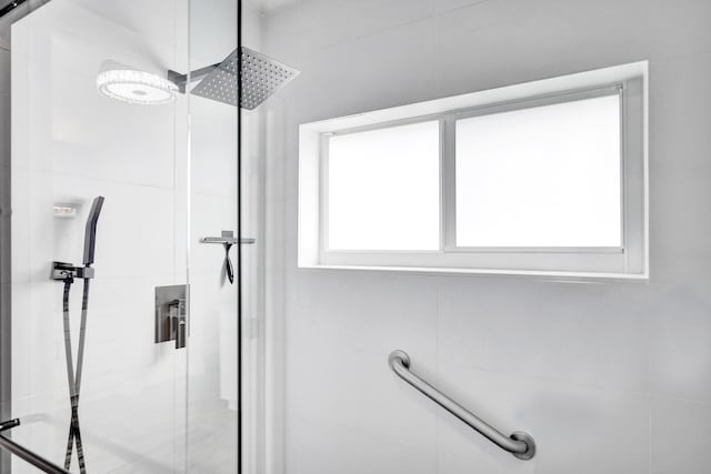 bathroom with a shower stall
