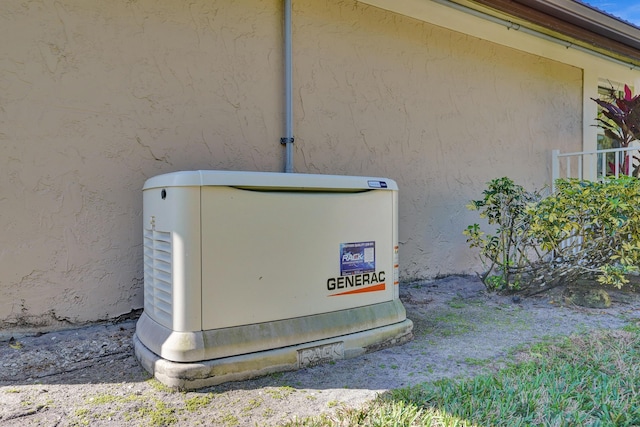 details featuring a power unit and stucco siding