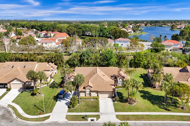 bird's eye view with a residential view and a water view