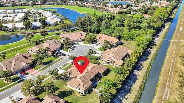 aerial view featuring a water view and a residential view