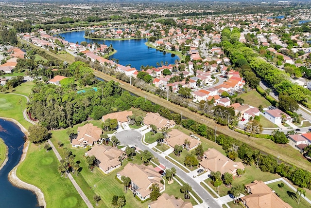 bird's eye view with a water view and a residential view