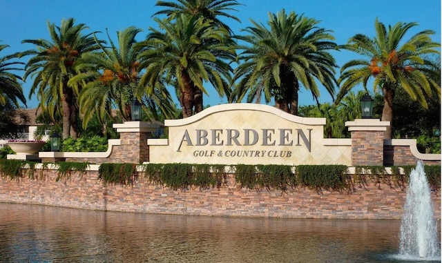 community sign with a water view