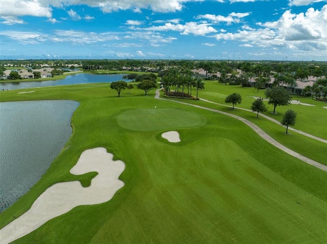view of community featuring view of golf course and a water view