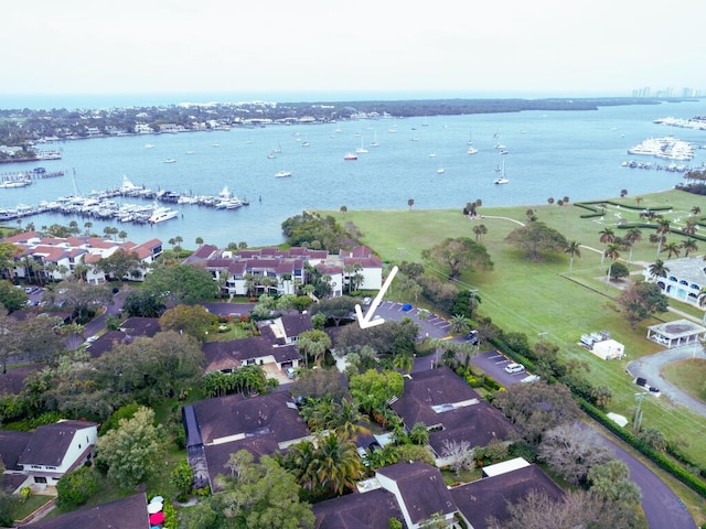 drone / aerial view featuring a water view and a residential view