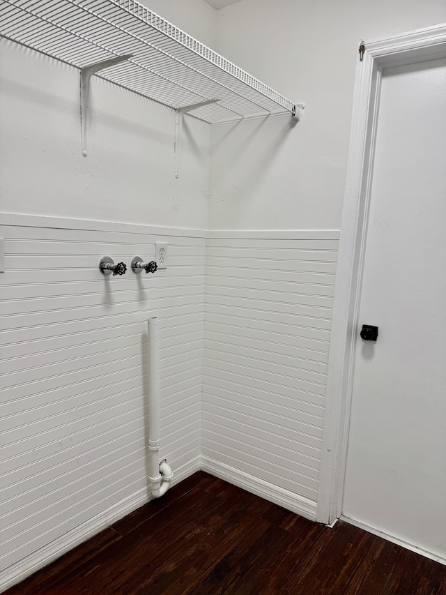 washroom featuring dark wood-style floors and laundry area