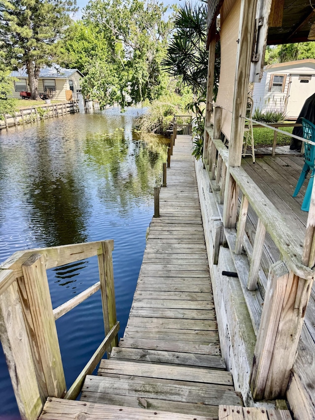 view of dock with a water view