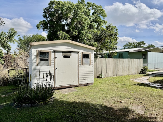 view of shed with a fenced backyard