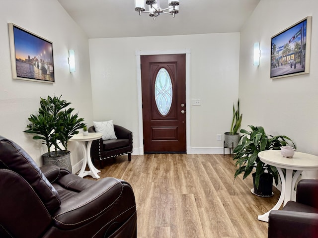 2532 NW 33rd Ave, Okeechobee, FL 34972 - entrance foyer featuring baseboards, a notable chandelier, and wood finished floors