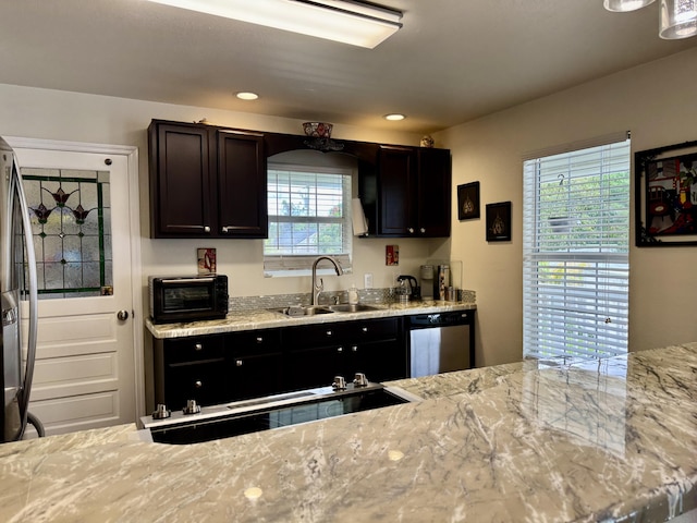 2532 NW 33rd Ave, Okeechobee, FL 34972 - kitchen featuring light stone counters, appliances with stainless steel finishes, a toaster, and a sink