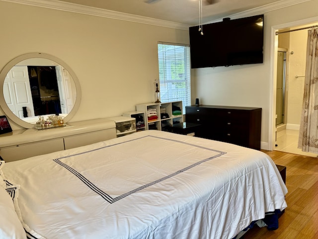 2532 NW 33rd Ave, Okeechobee, FL 34972 - bedroom featuring baseboards, ensuite bathroom, ornamental molding, and wood finished floors