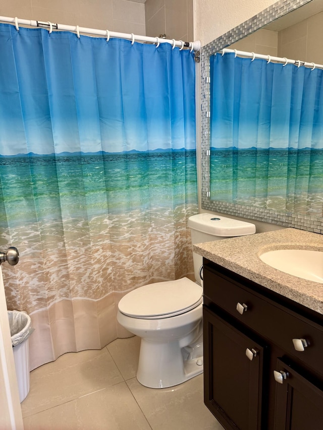2532 NW 33rd Ave, Okeechobee, FL 34972 - bathroom featuring vanity, toilet, a shower with shower curtain, and tile patterned floors