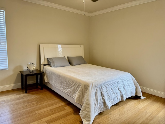 2532 NW 33rd Ave, Okeechobee, FL 34972 - bedroom with crown molding, baseboards, and light wood-style floors