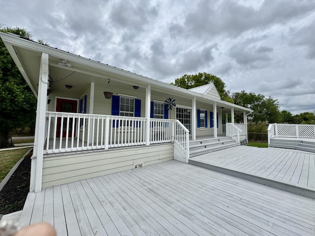 2532 NW 33rd Ave, Okeechobee, FL 34972 - wooden deck featuring a porch