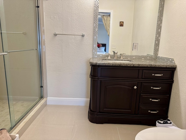 2532 NW 33rd Ave, Okeechobee, FL 34972 - bathroom with toilet, baseboards, tile patterned flooring, a shower stall, and vanity