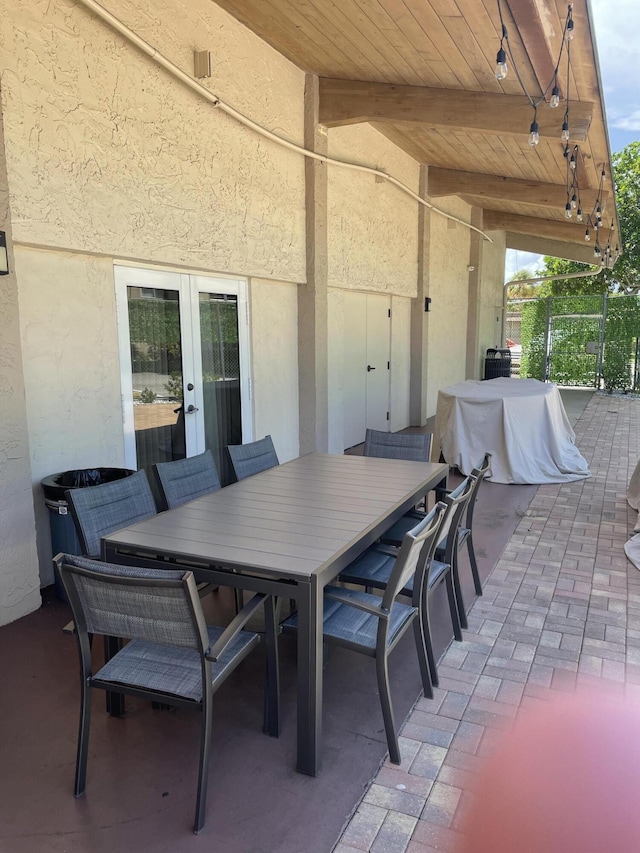 view of patio / terrace featuring french doors and outdoor dining area