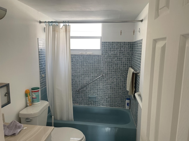 full bath with shower / tub combo and toilet