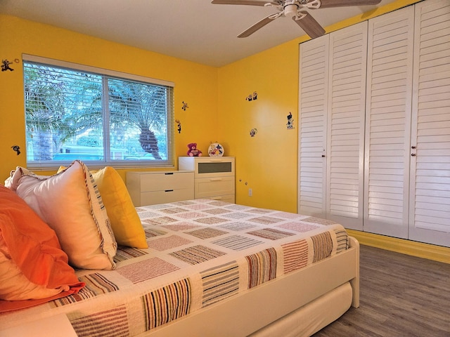 bedroom with ceiling fan, a closet, and wood finished floors