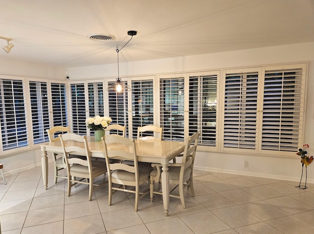 dining area with visible vents, baseboards, and light tile patterned floors