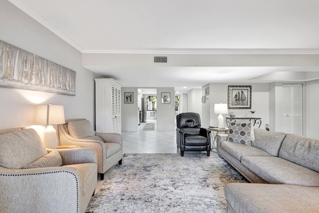 tiled living area featuring visible vents and crown molding