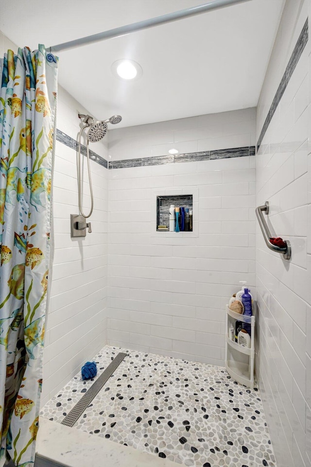 full bath featuring a shower stall