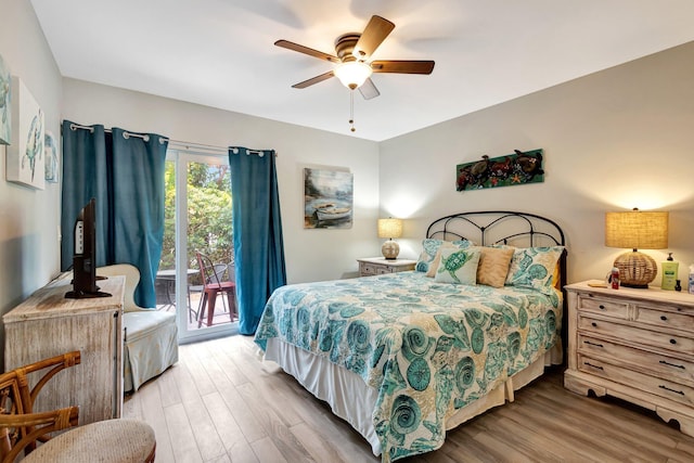 bedroom featuring access to exterior, ceiling fan, and wood finished floors