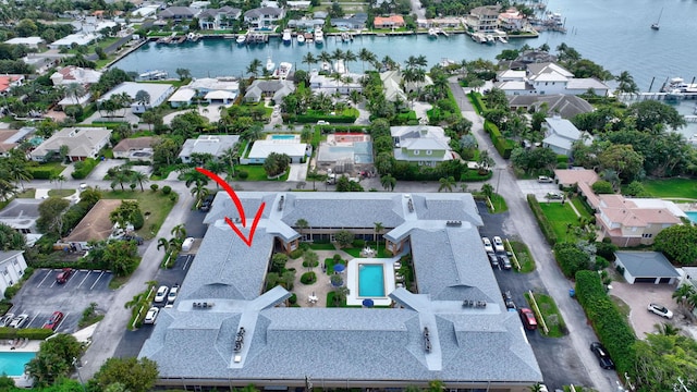 aerial view featuring a water view and a residential view