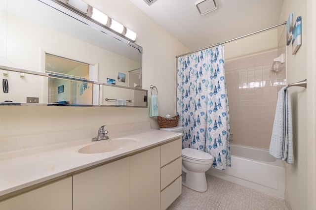 bathroom with toilet, shower / bath combo with shower curtain, and vanity