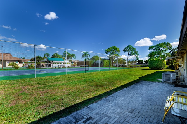 exterior space with fence and a lawn