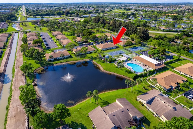 birds eye view of property with a water view and a residential view