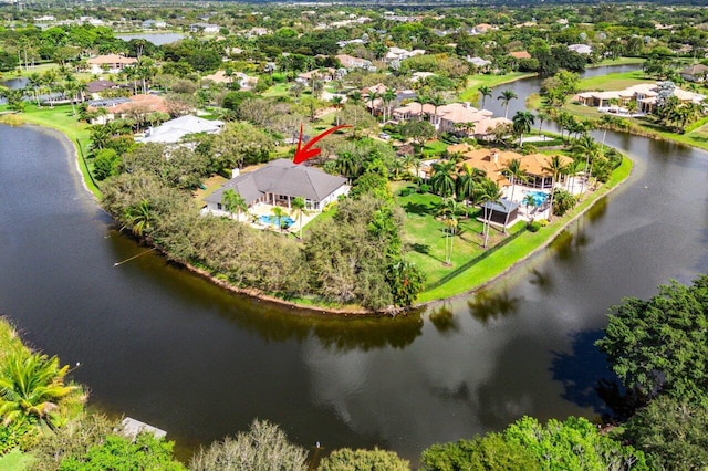 drone / aerial view featuring a water view and a residential view