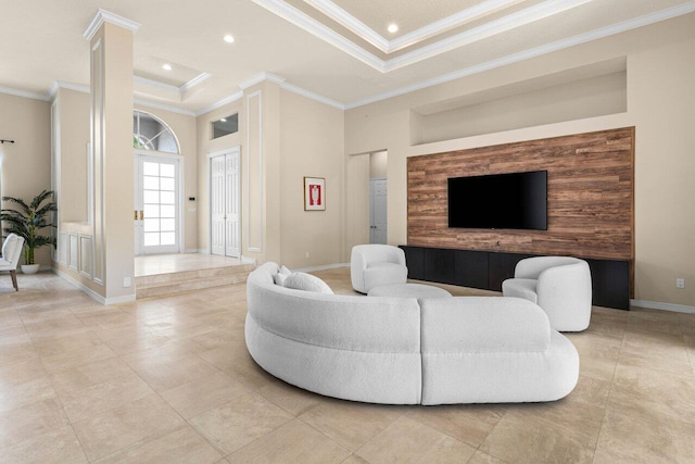 living area featuring ornamental molding, a tray ceiling, recessed lighting, and baseboards