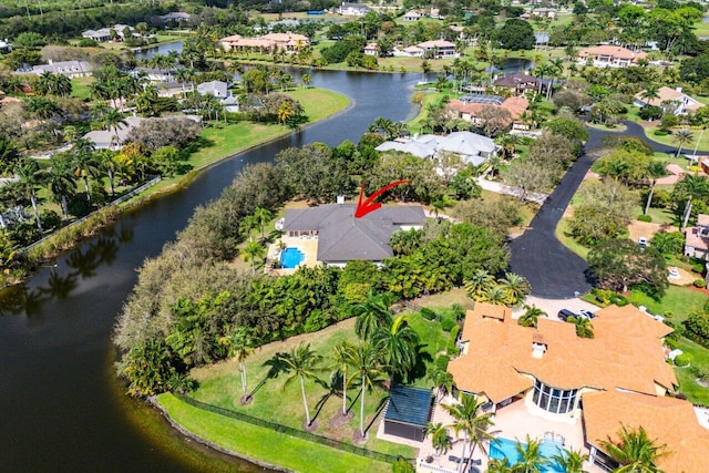 bird's eye view featuring a water view and a residential view