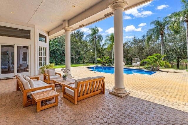 view of patio / terrace featuring an outdoor pool and outdoor lounge area