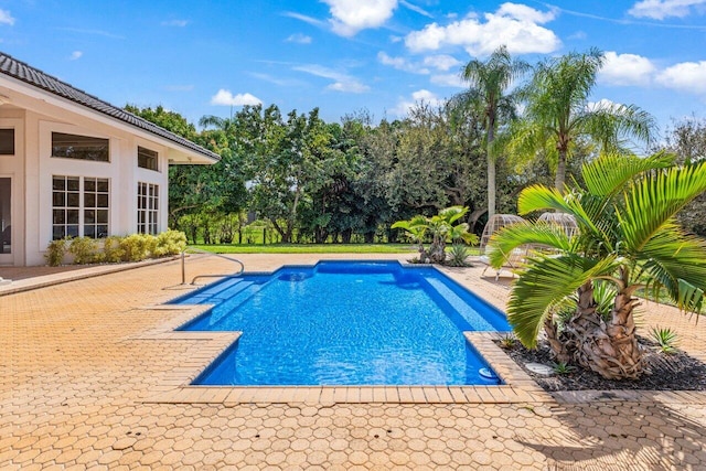 outdoor pool with a patio