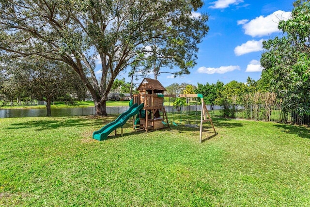 view of play area featuring a fenced backyard and a yard