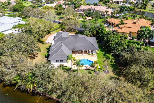 birds eye view of property featuring a water view