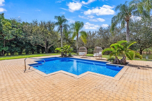 pool with a patio area