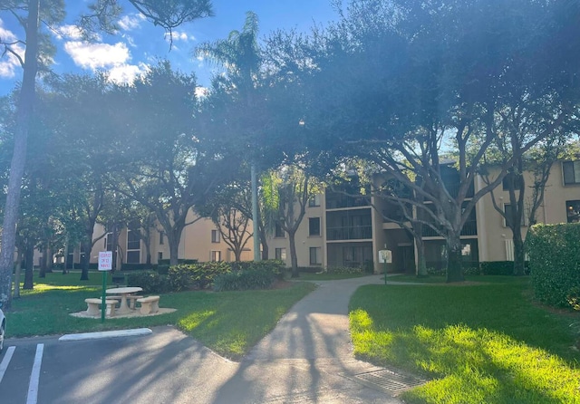 view of home's community featuring a yard