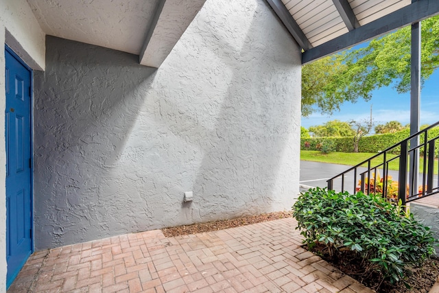 view of side of property featuring stucco siding