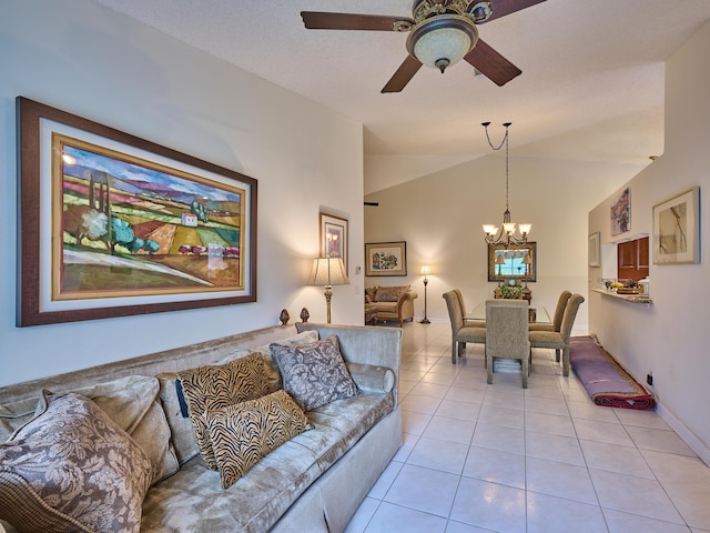 living area featuring light tile patterned flooring, vaulted ceiling, and ceiling fan with notable chandelier