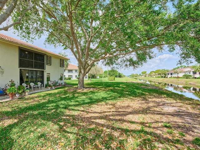 view of yard with a water view