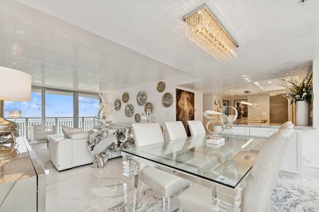 dining room featuring marble finish floor