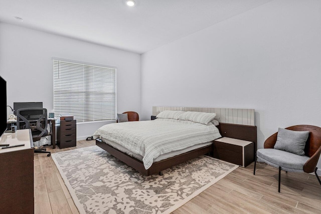 bedroom with light wood finished floors