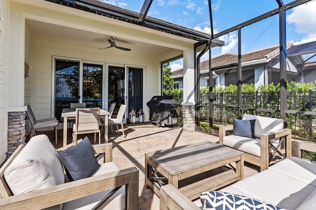 view of patio with a ceiling fan, a lanai, a grill, outdoor dining area, and outdoor lounge area