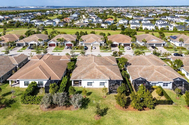 birds eye view of property with a residential view