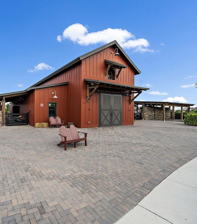 view of barn featuring an exterior structure