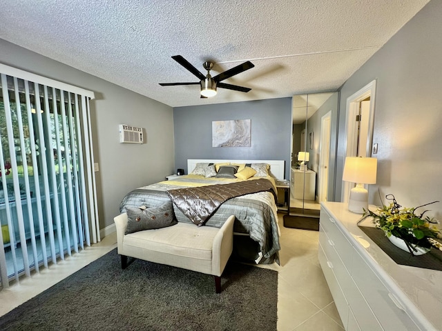 172 Tilford I, Deerfield Beach, FL 33442 - bedroom with a textured ceiling, ceiling fan, and a wall unit AC