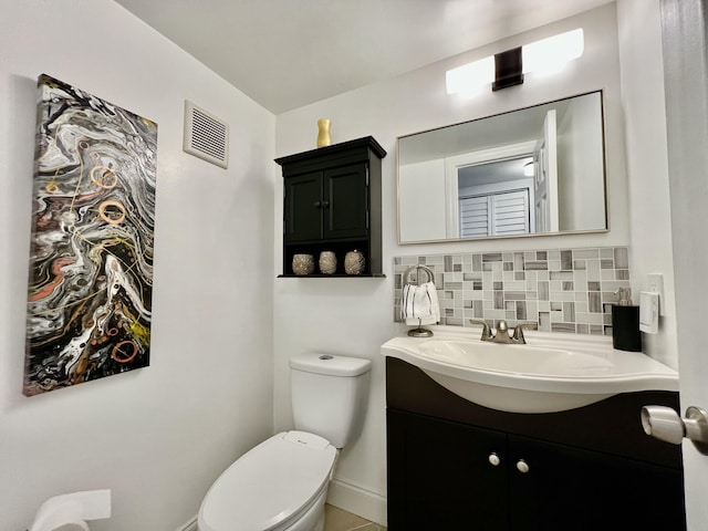 172 Tilford I, Deerfield Beach, FL 33442 - half bath with toilet, tasteful backsplash, vanity, and visible vents