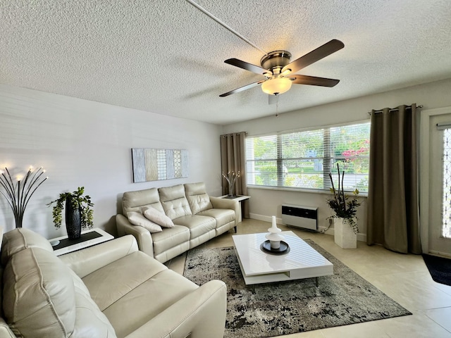 172 Tilford I, Deerfield Beach, FL 33442 - living room with a ceiling fan and a textured ceiling