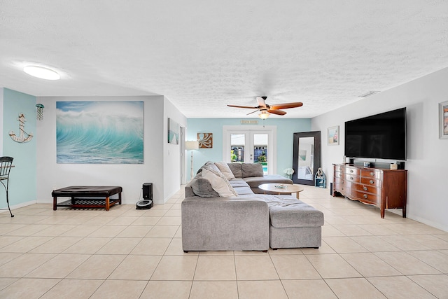 living room with a textured ceiling, french doors, light tile patterned flooring, and a ceiling fan